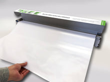 Wizard Wall 27.5 x 25 ft white dry erase film being pulled from dispenser 
